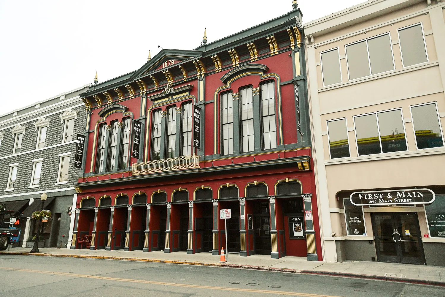 A row of identical arched bays running along the front of the First & Main building in Napa.